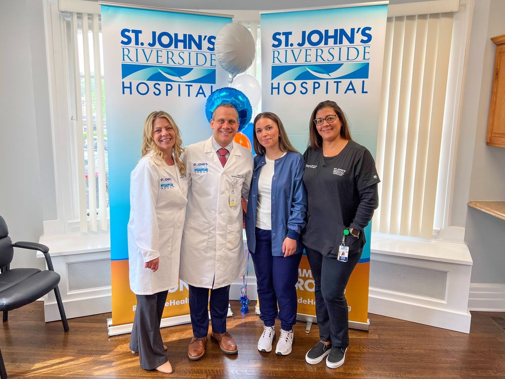 Dr. Erosa with the center team